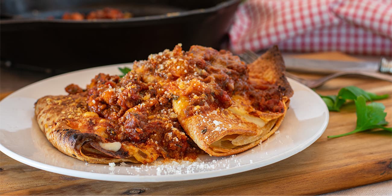 Italian cuisine - filled pancakes or crespelle with bolognese sa